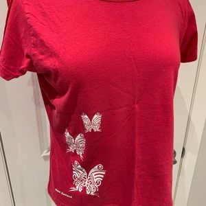 Red T-shirt,  print on front of NZ Maori faces